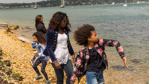 Visitors on the beach on Brownsea Island, Poole Harbour, Dorset